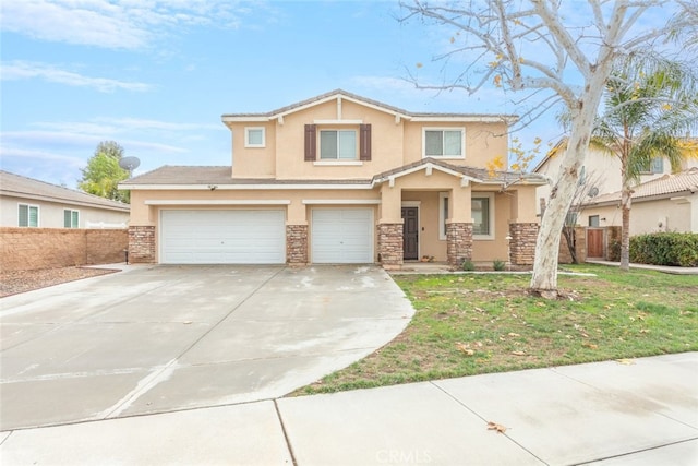 view of front of home featuring stucco siding, driveway, stone siding, an attached garage, and fence