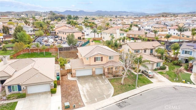 drone / aerial view with a mountain view and a residential view