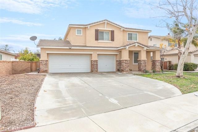 view of front of property with stucco siding, stone siding, concrete driveway, and fence