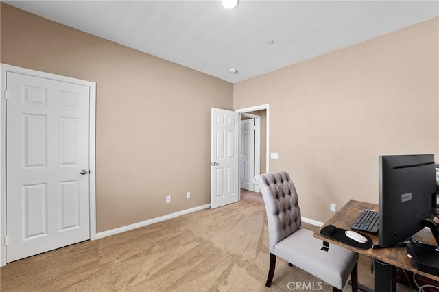 office featuring light carpet and baseboards