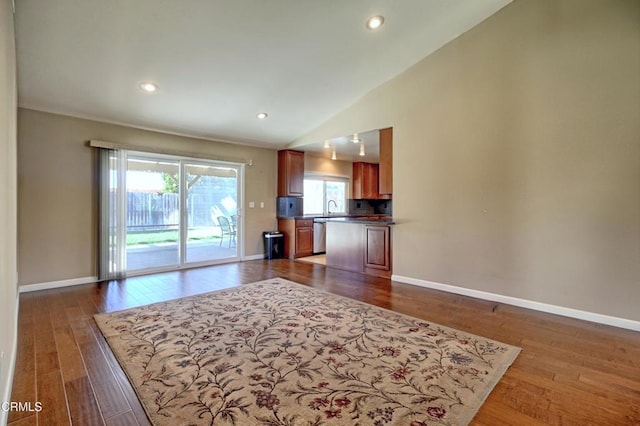 living area with dark wood finished floors and baseboards