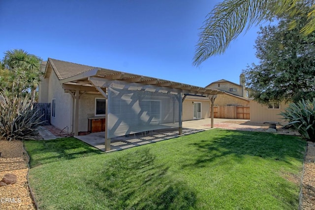 back of property featuring a patio area, fence, a lawn, and a pergola