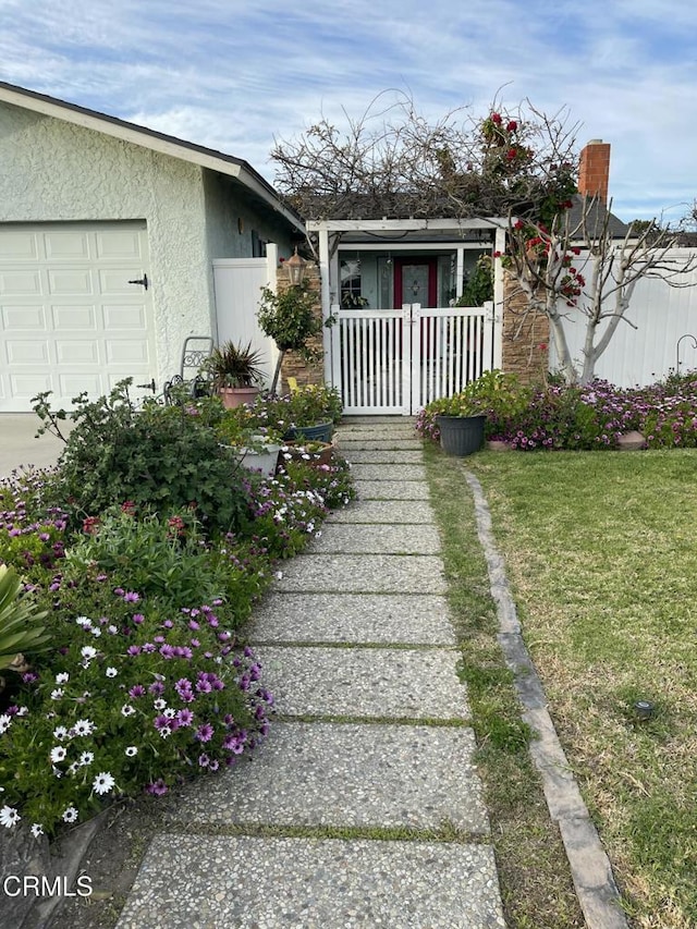 view of yard featuring a garage and fence