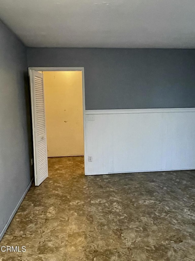 empty room with wainscoting