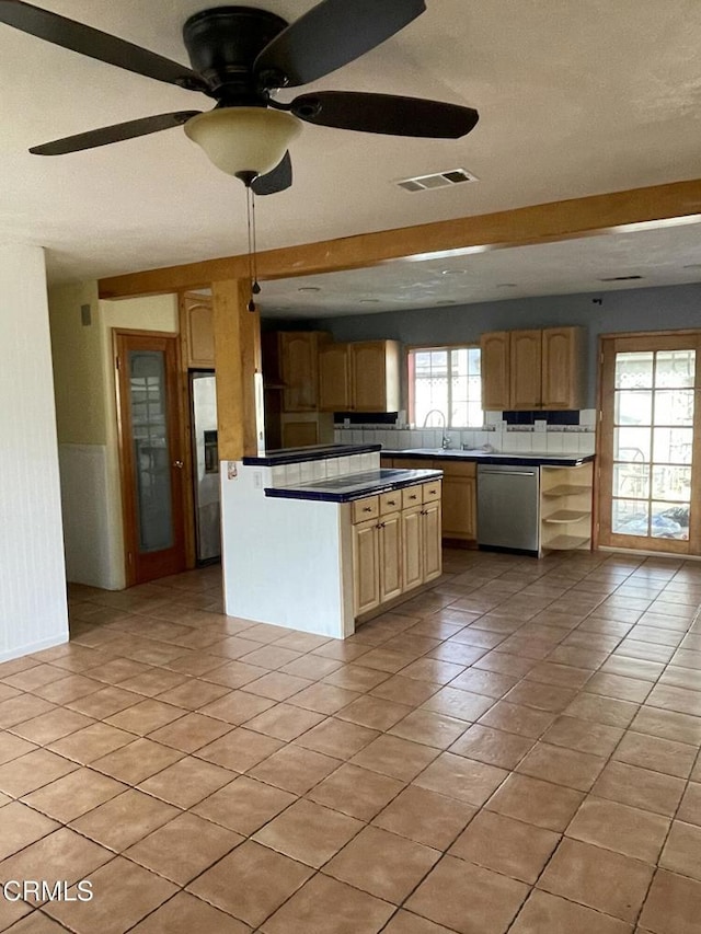 kitchen with light tile patterned flooring, visible vents, a ceiling fan, stainless steel dishwasher, and dark countertops