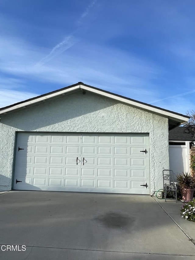 garage with driveway