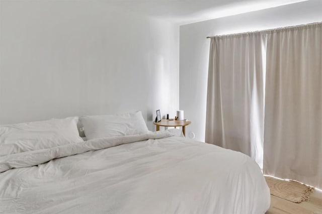 bedroom with wood finished floors