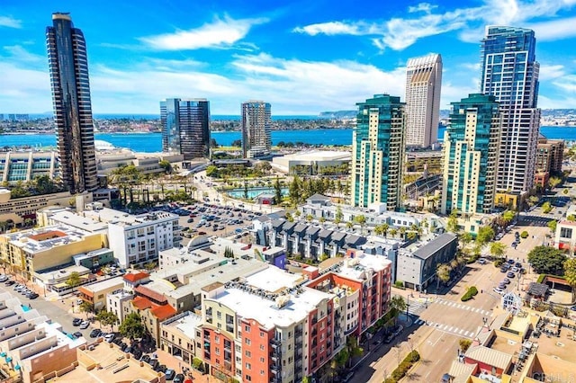 drone / aerial view featuring a view of city and a water view