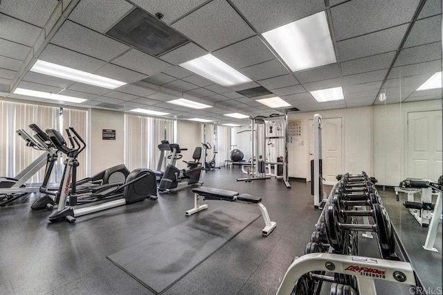 workout area with a paneled ceiling