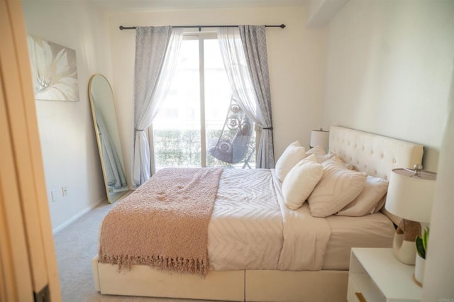 bedroom with carpet and baseboards