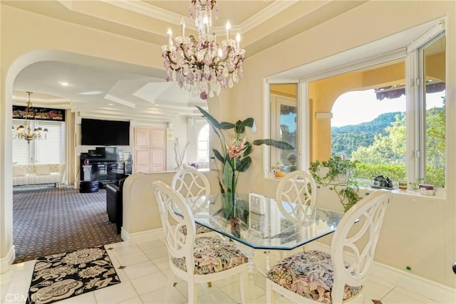 22537 N Summit Ridge Cir, Chatsworth, CA 91311 - tiled dining room with a chandelier, a raised ceiling, healthy amount of natural light, crown molding, and arched walkways