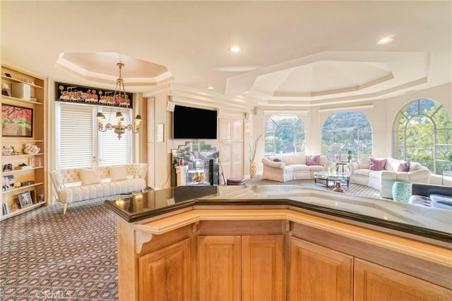 22537 N Summit Ridge Cir, Chatsworth, CA 91311 - kitchen with a raised ceiling, open floor plan, healthy amount of natural light, and crown molding