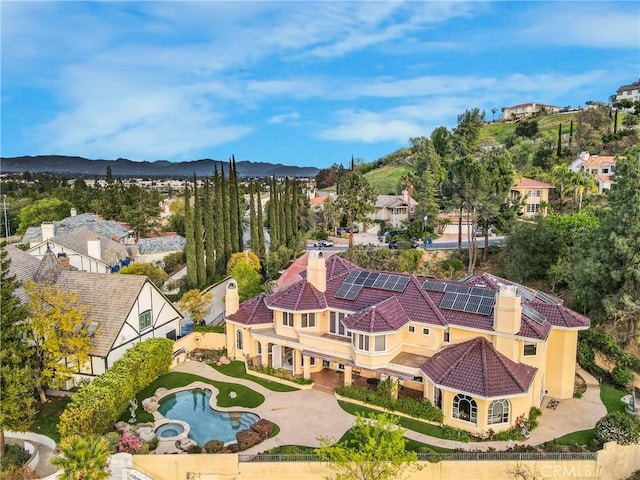 birds eye view of property featuring a mountain view