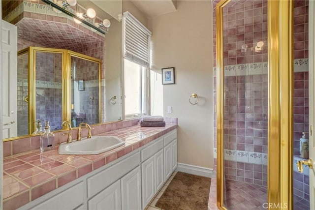 22537 N Summit Ridge Cir, Chatsworth, CA 91311 - full bathroom with vanity, a shower stall, baseboards, and tile patterned flooring