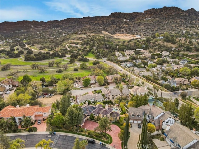 22537 N Summit Ridge Cir, Chatsworth, CA 91311 - aerial view of property's location featuring a mountainous background and nearby suburban area