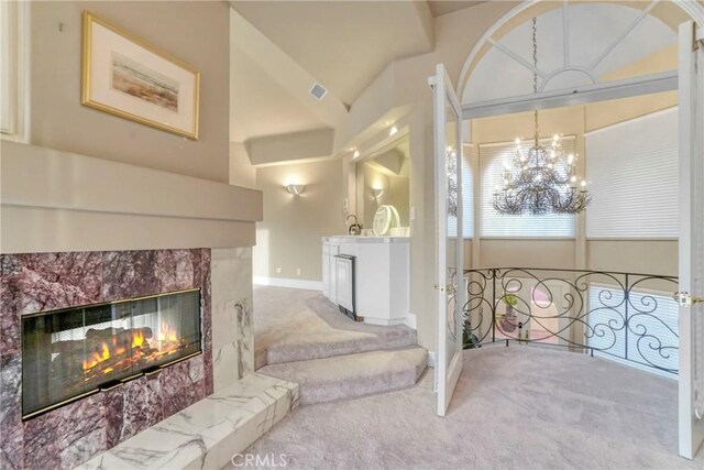 22537 N Summit Ridge Cir, Chatsworth, CA 91311 - living room with a premium fireplace, carpet, a chandelier, baseboards, and lofted ceiling