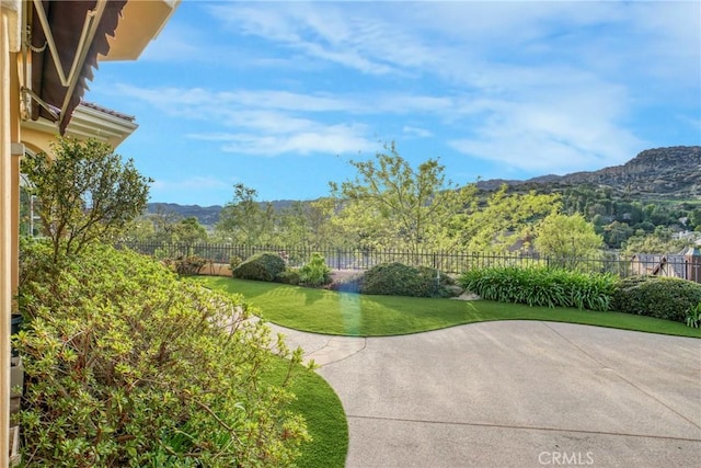 22537 N Summit Ridge Cir, Chatsworth, CA 91311 - surrounding community featuring a mountain view and a patio area