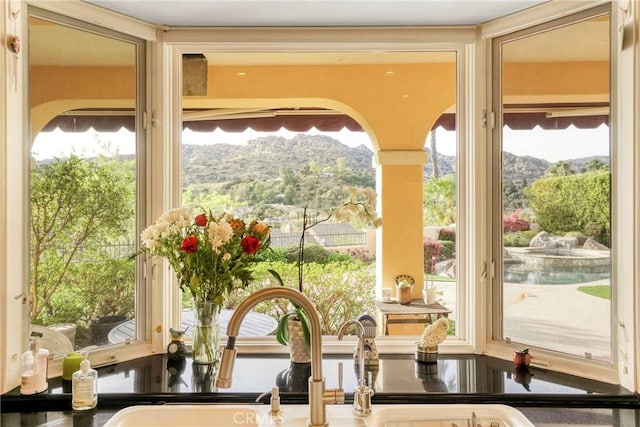 22537 N Summit Ridge Cir, Chatsworth, CA 91311 - doorway to outside with a mountain view and a sink