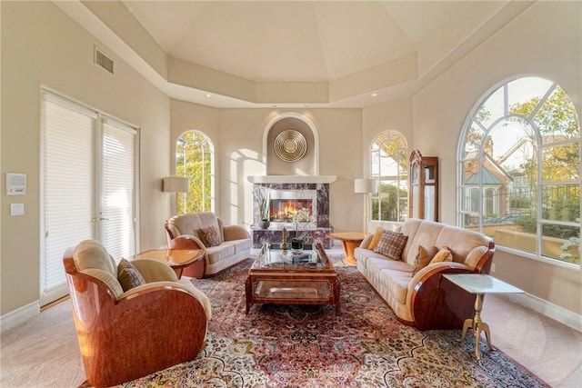 22537 N Summit Ridge Cir, Chatsworth, CA 91311 - living room featuring baseboards, a premium fireplace, healthy amount of natural light, carpet flooring, and a high ceiling