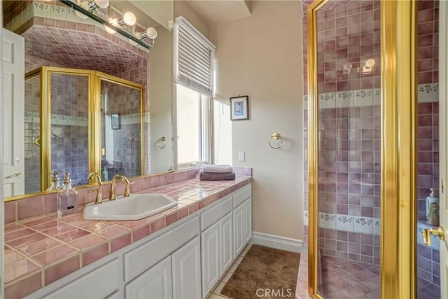 22537 N Summit Ridge Cir, Chatsworth, CA 91311 - bathroom featuring vanity, a stall shower, baseboards, and tile patterned floors