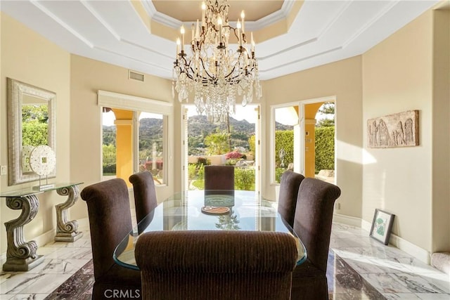 22537 N Summit Ridge Cir, Chatsworth, CA 91311 - dining space featuring marble tiled flooring, a chandelier, a tray ceiling, plenty of natural light, and ornamental molding