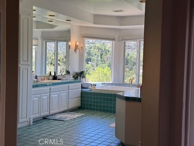 22537 N Summit Ridge Cir, Chatsworth, CA 91311 - bathroom with vanity, a bath, and tile patterned flooring