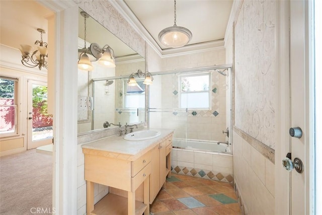 full bath featuring tiled shower / bath combo, vanity, and crown molding