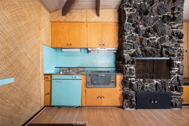 kitchen with wooden ceiling, lofted ceiling with beams, wood finished floors, a stone fireplace, and under cabinet range hood