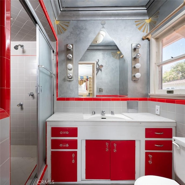 bathroom featuring a shower stall, backsplash, toilet, and vanity