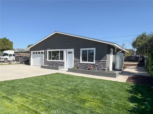 ranch-style home featuring stucco siding, an attached garage, a front yard, stone siding, and driveway