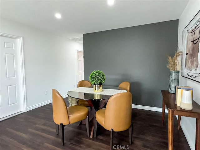 dining room featuring recessed lighting, wood finished floors, visible vents, and baseboards