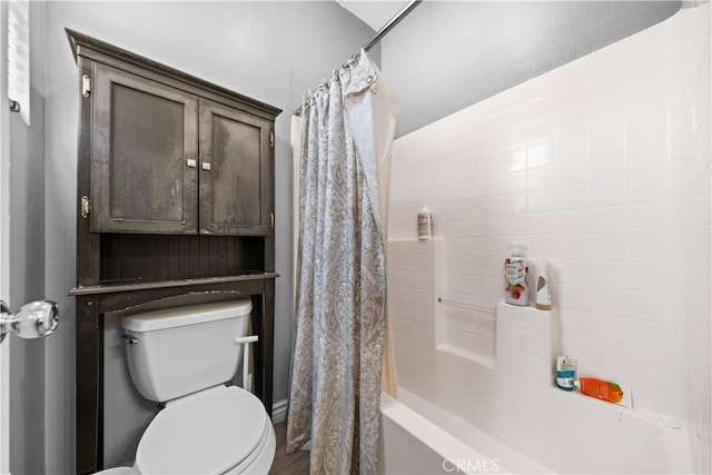 full bath with shower / bath combination with curtain and toilet