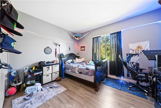 bedroom featuring wood finished floors