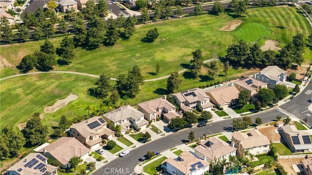 aerial view with view of golf course and a residential view