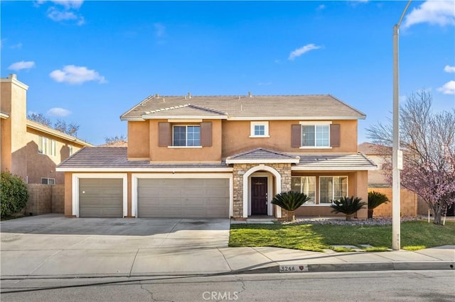 traditional-style home featuring concrete driveway, a tile roof, fence, and stucco siding