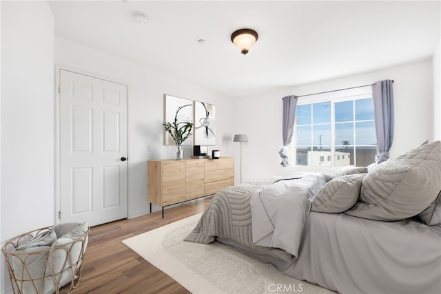 bedroom featuring wood finished floors