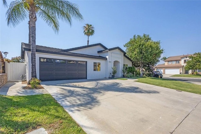 37211 Jerome Ln, Murrieta, CA 92562 - view of front of home featuring driveway, a garage, and stucco siding