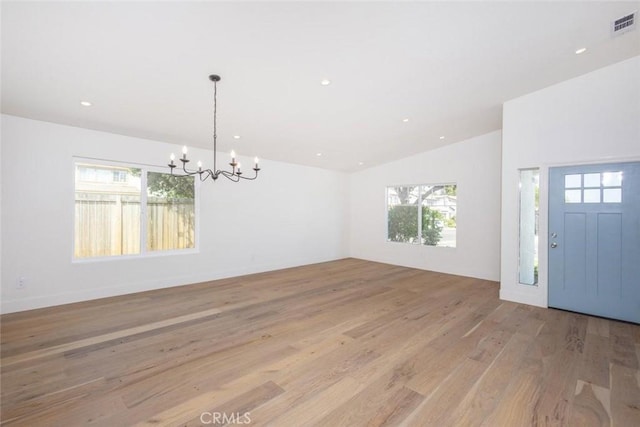37211 Jerome Ln, Murrieta, CA 92562 - foyer with a chandelier, light wood finished floors, vaulted ceiling, and recessed lighting