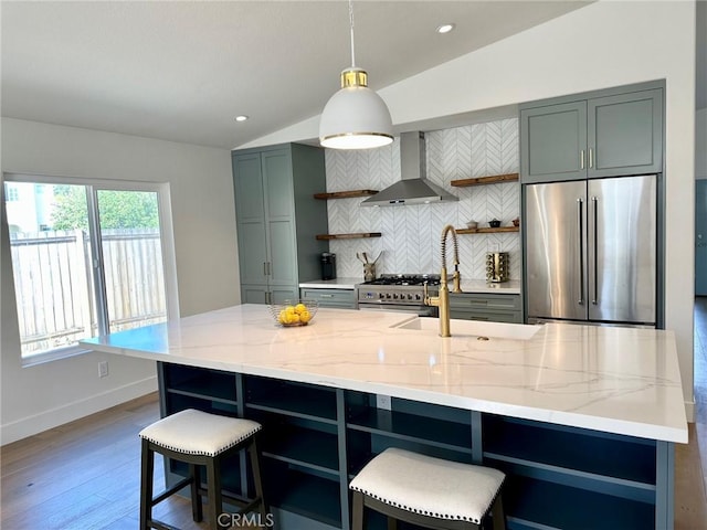 37211 Jerome Ln, Murrieta, CA 92562 - kitchen with open shelves, stainless steel appliances, wall chimney range hood, vaulted ceiling, and a sink