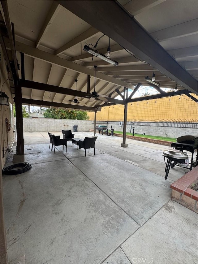 view of home's community with a patio area, fence, and an outdoor living space