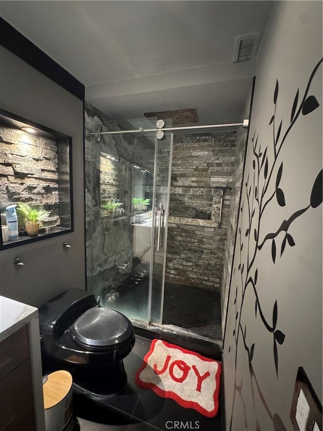 full bath featuring visible vents, a stall shower, vanity, and toilet