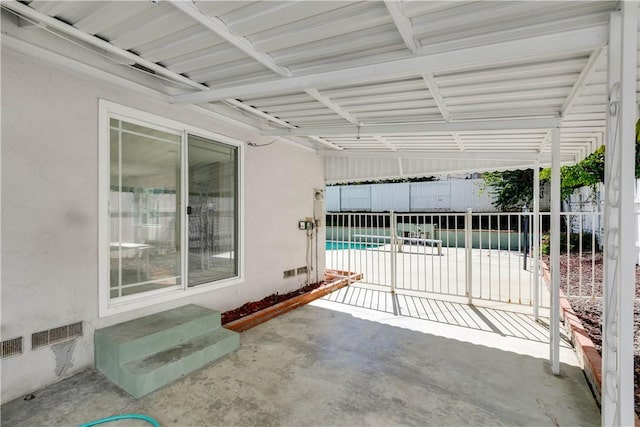 view of patio featuring fence