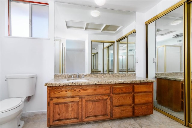 full bath with a shower with door, vanity, and toilet