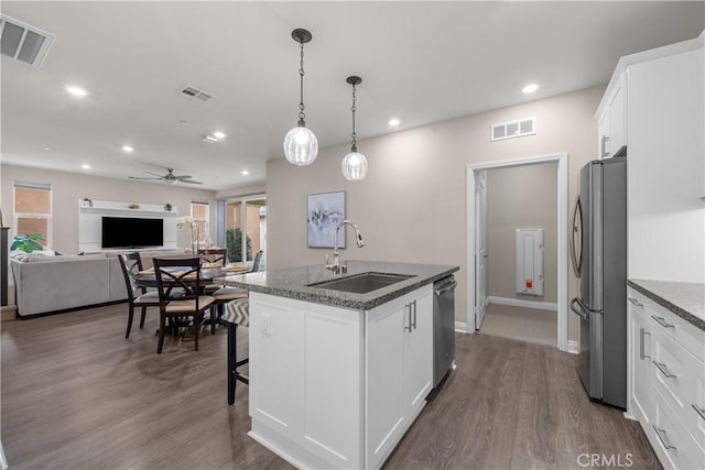 kitchen with visible vents, appliances with stainless steel finishes, and a sink