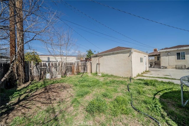 view of yard featuring a patio area and fence