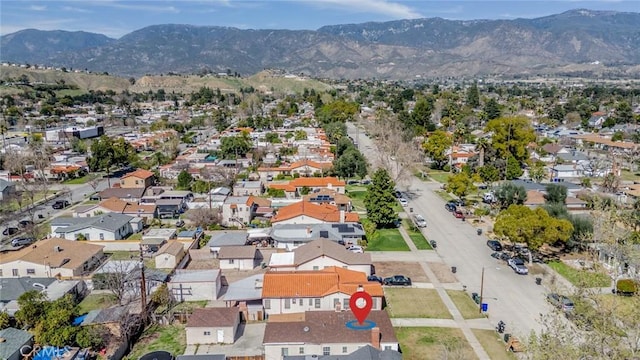 birds eye view of property with a residential view and a mountain view