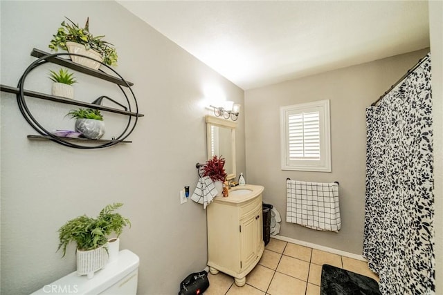 bathroom featuring vanity, curtained shower, tile patterned flooring, and toilet