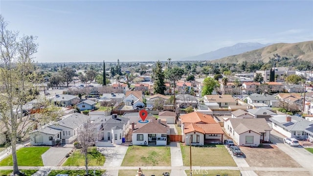 birds eye view of property with a residential view and a mountain view