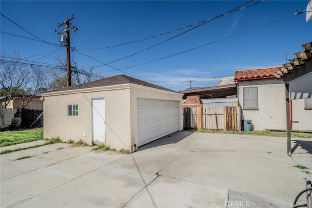 detached garage with fence