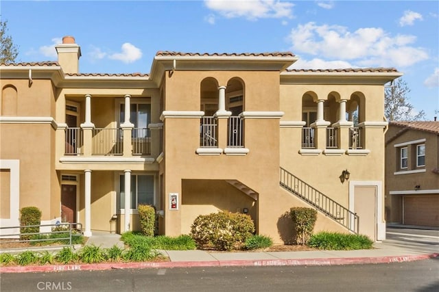 view of property with stairway